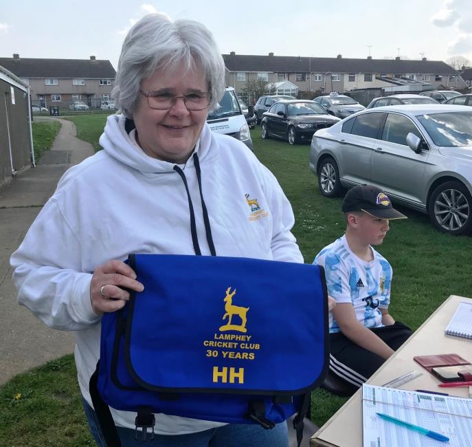 Helen proudly shows off her new briefcase